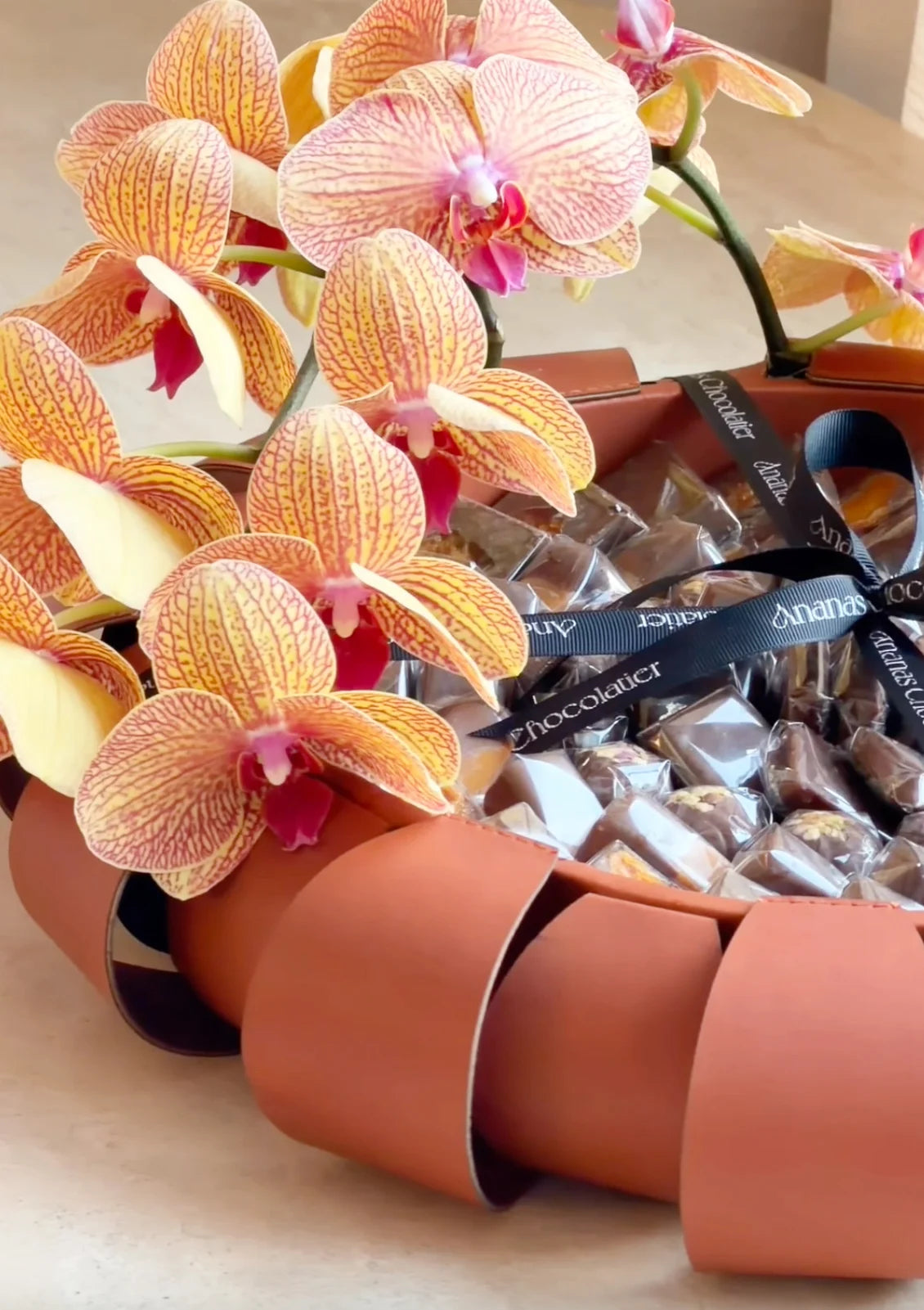 Amber Aura – Orchid & Chocolate Arrangement