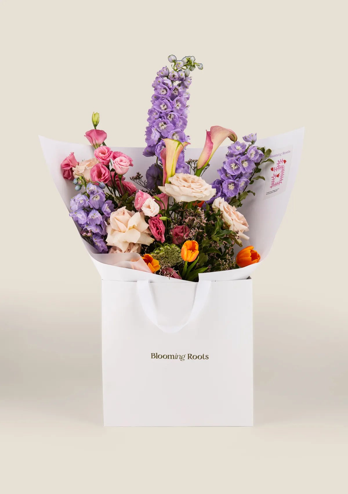 Harmony Medley Bouquet including Tulips, Calla, Roses Quicksand, Delphinium Sea Walt, Ammi and Eustoma flowers from Blooming Roots shop.