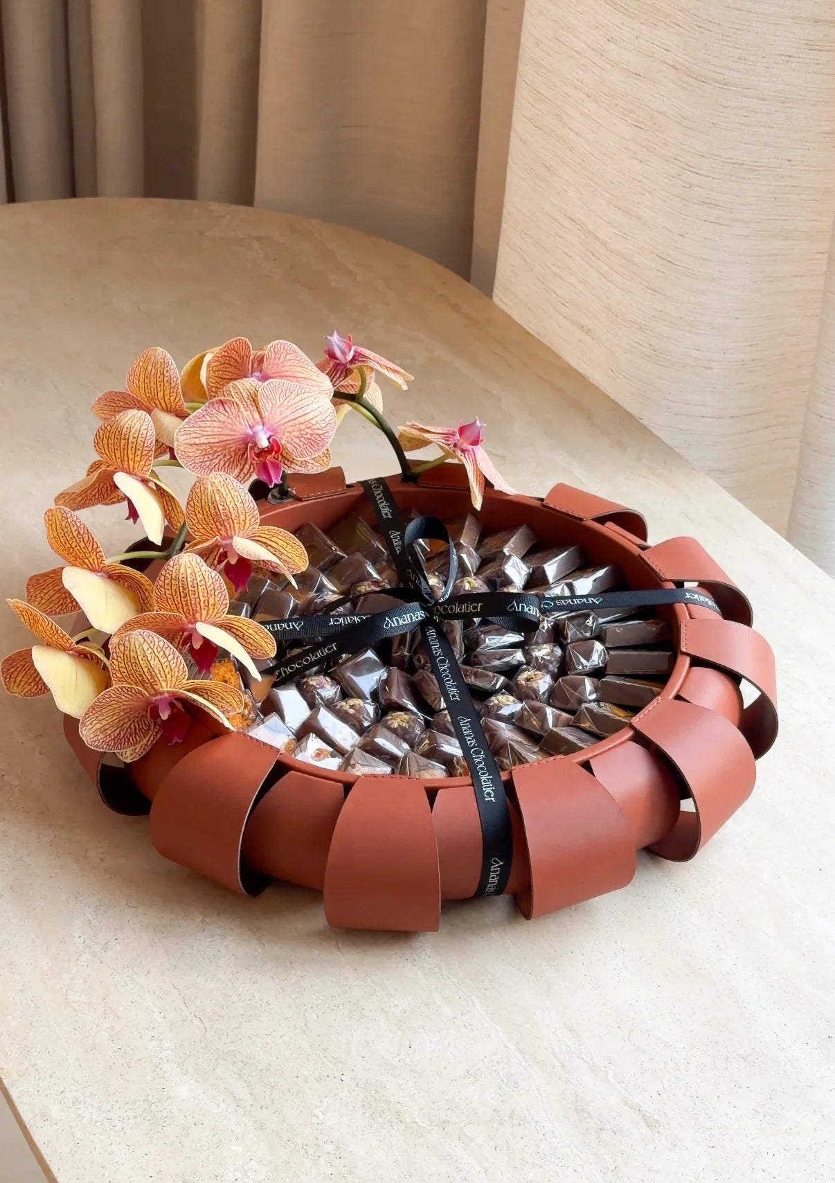 Amber Aura – Orchid & Chocolate Arrangement
