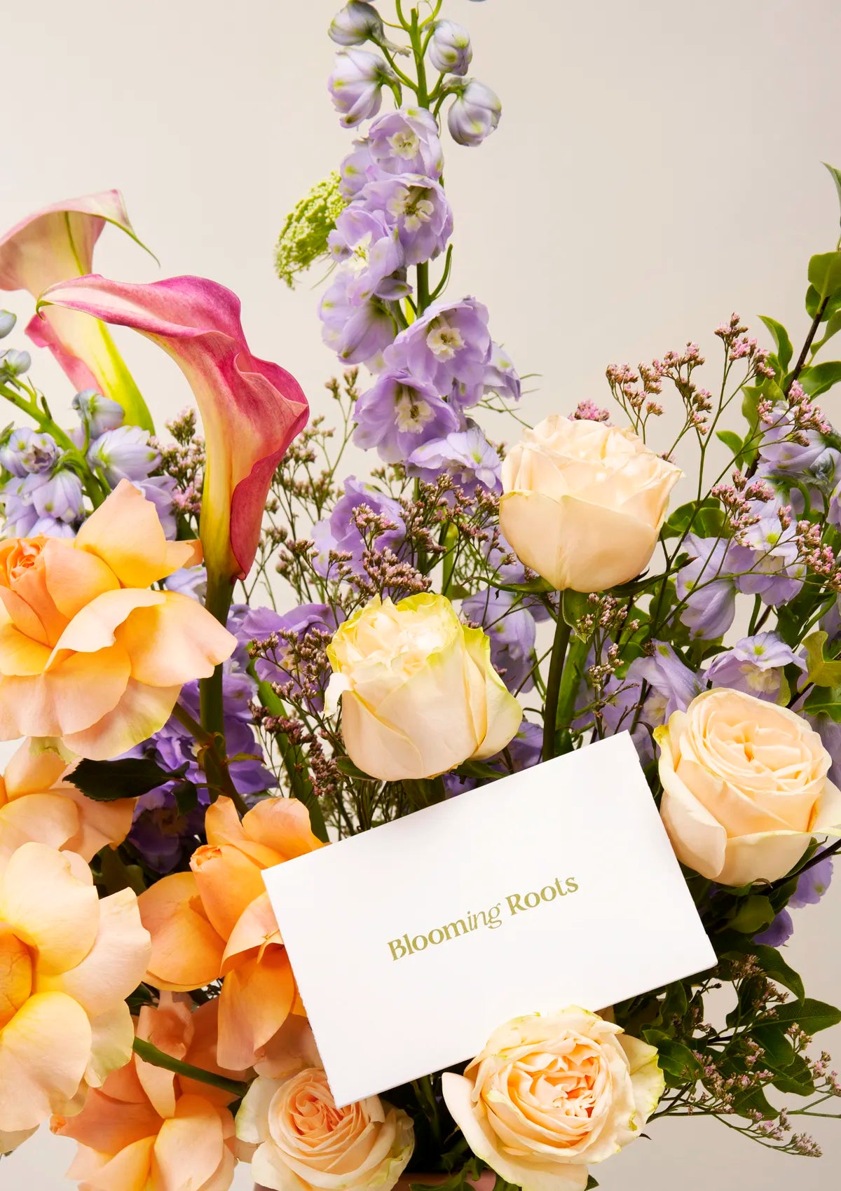 Ceramic Pink Romance Vase by Blooming Roots with a greeting card that has a logo on it.